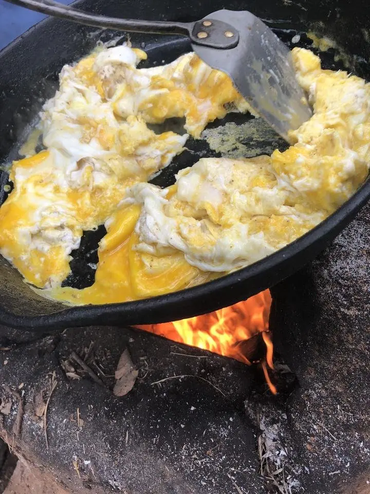 Scrambled eggs cooked over fire